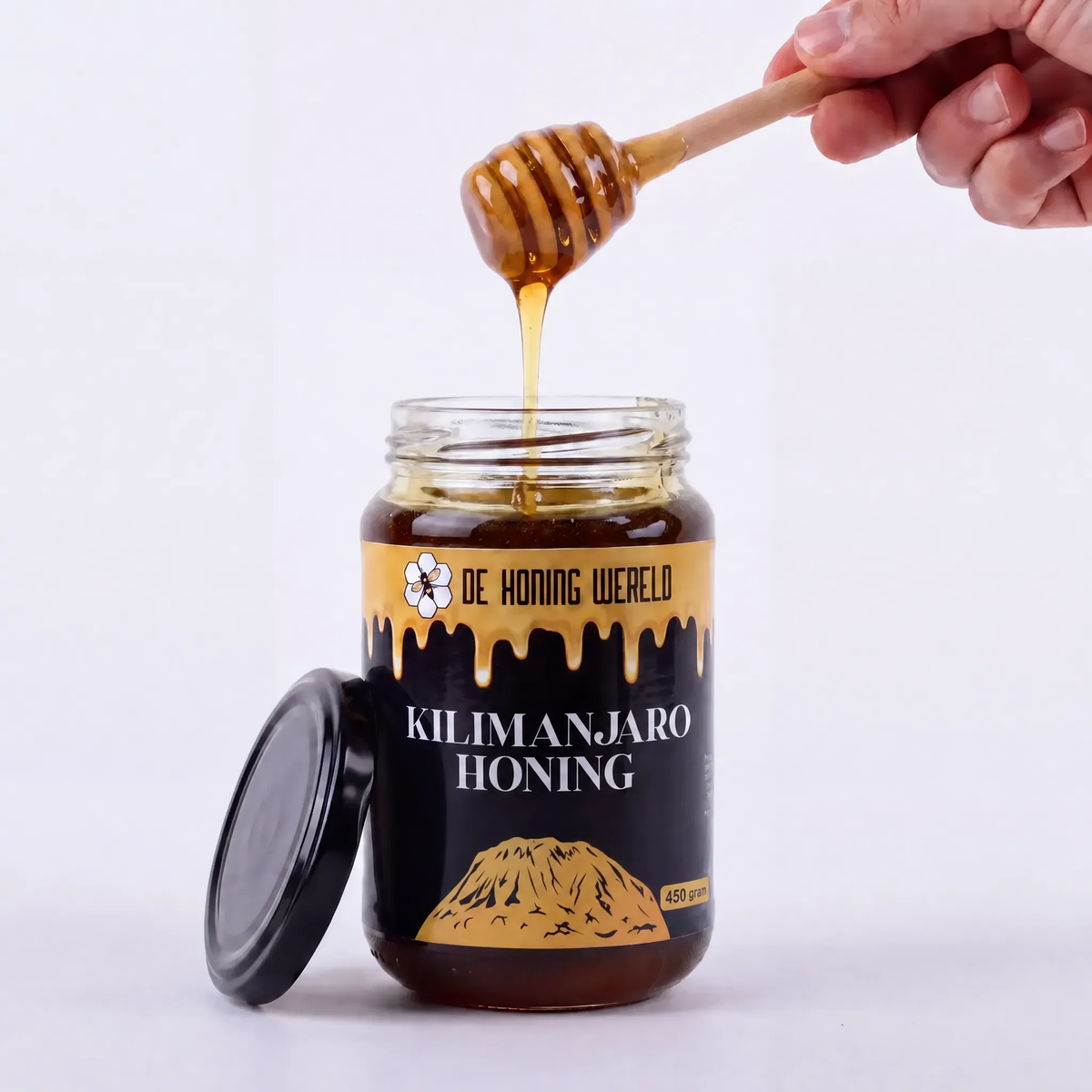 Open pot Kilimanjaro-honing van De Honing Wereld met houten honinglepel