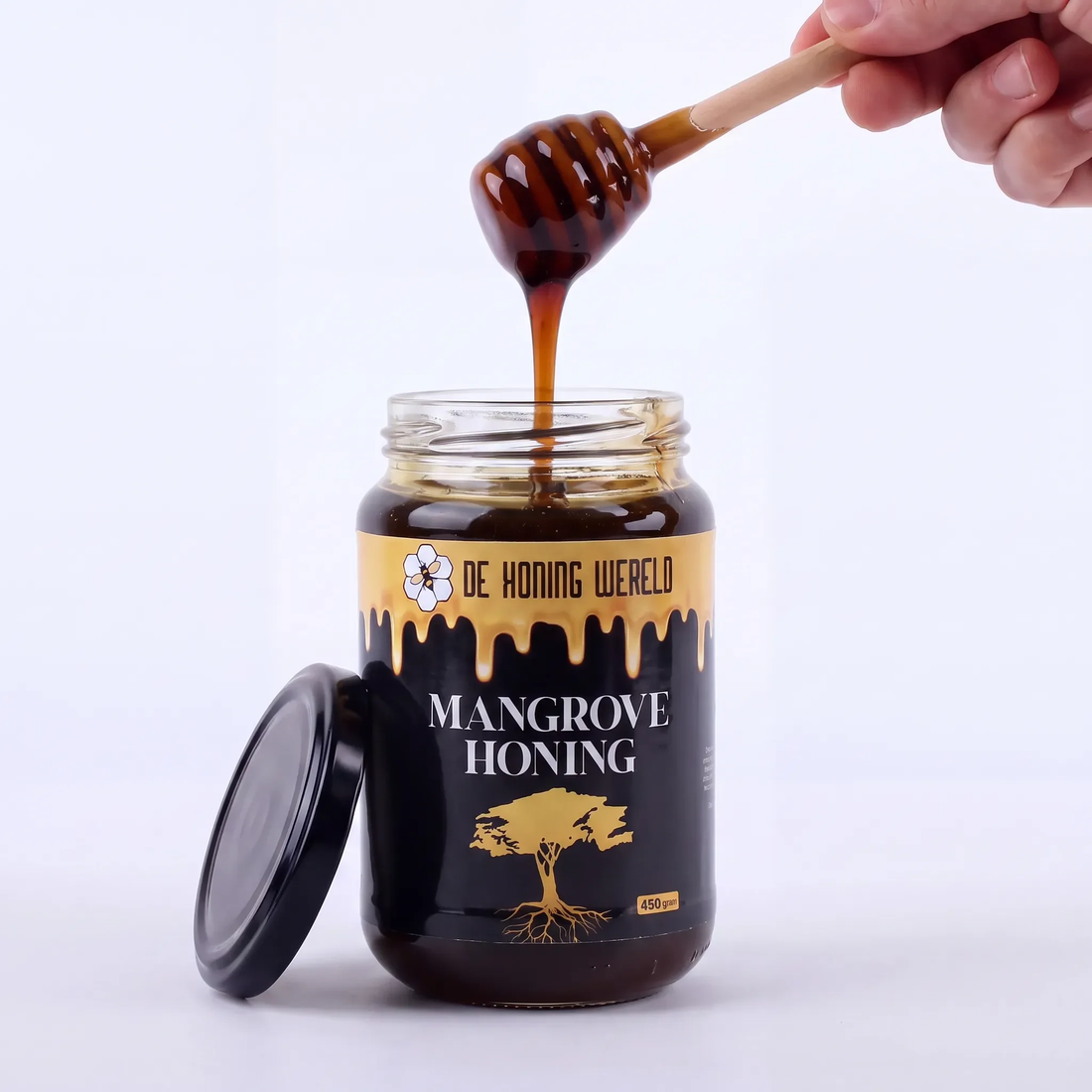 Open pot Mangrove-honing van De Honing Wereld met houten honinglepel