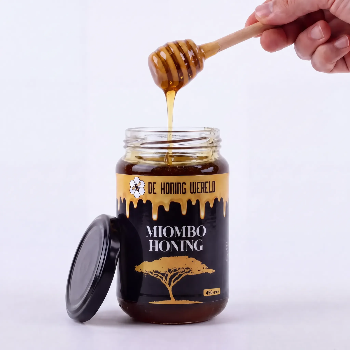 Open pot Miombo-honing van De Honing Wereld met houten honinglepel